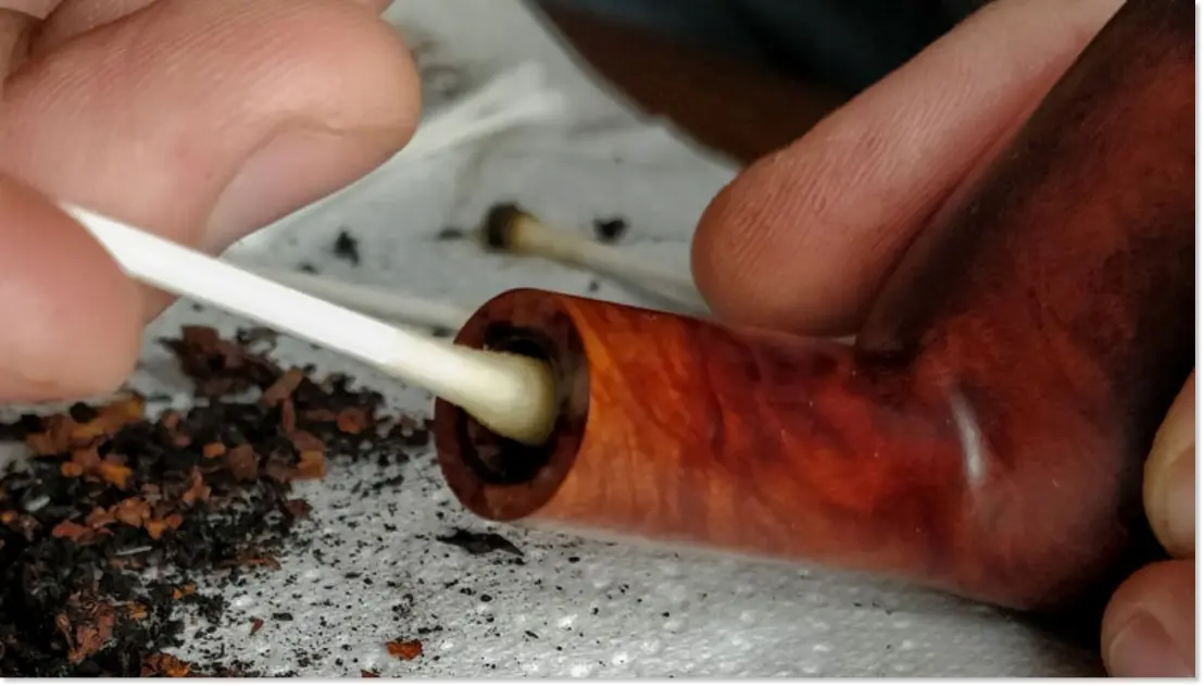 insert cotton swab for cleaning stem